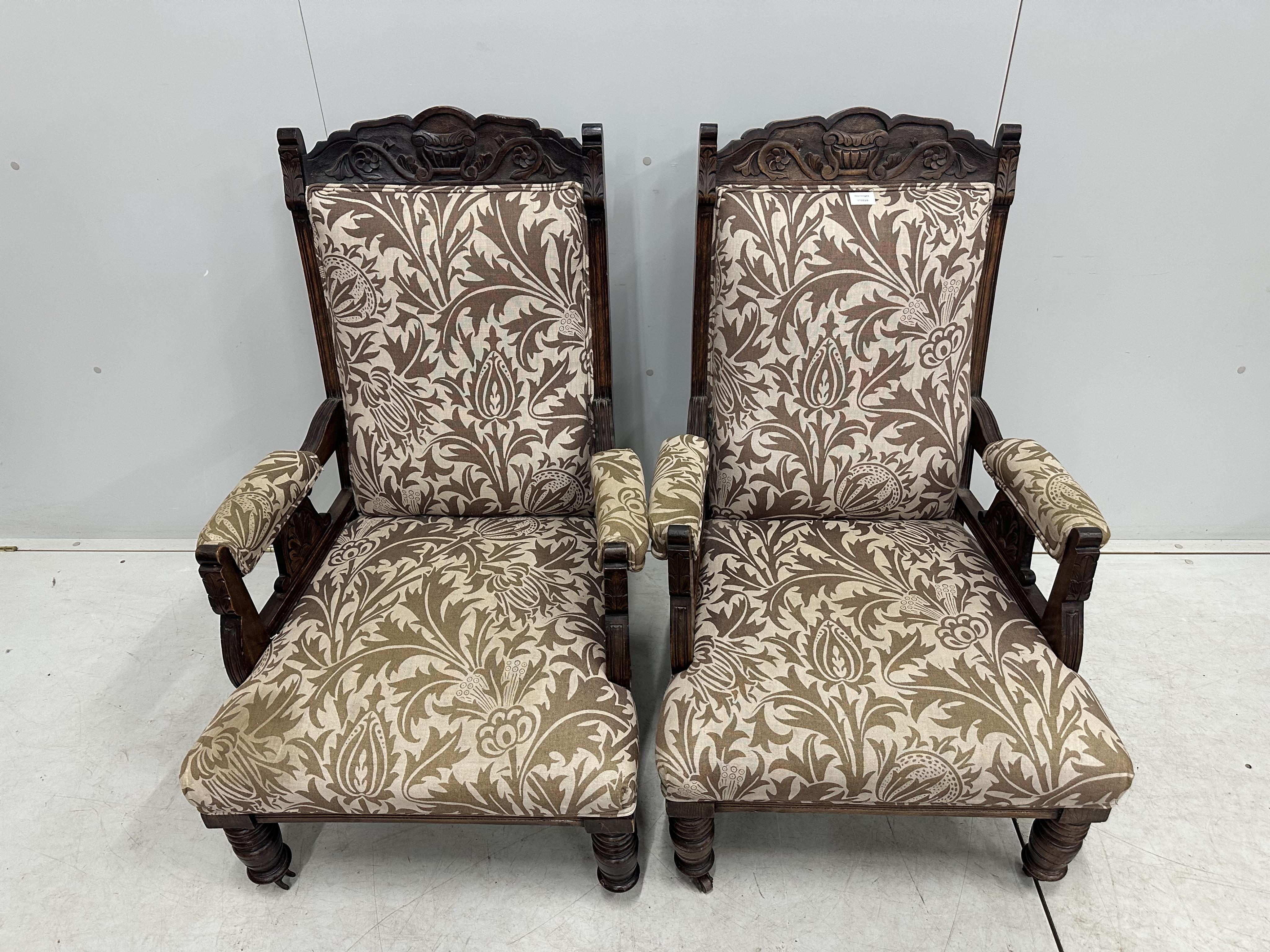 A pair of Victorian mahogany upholstered open armchairs, width 56cm, depth 62cm, height 101cm. Condition - fair